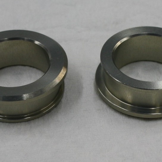 Captive front wheel spacers